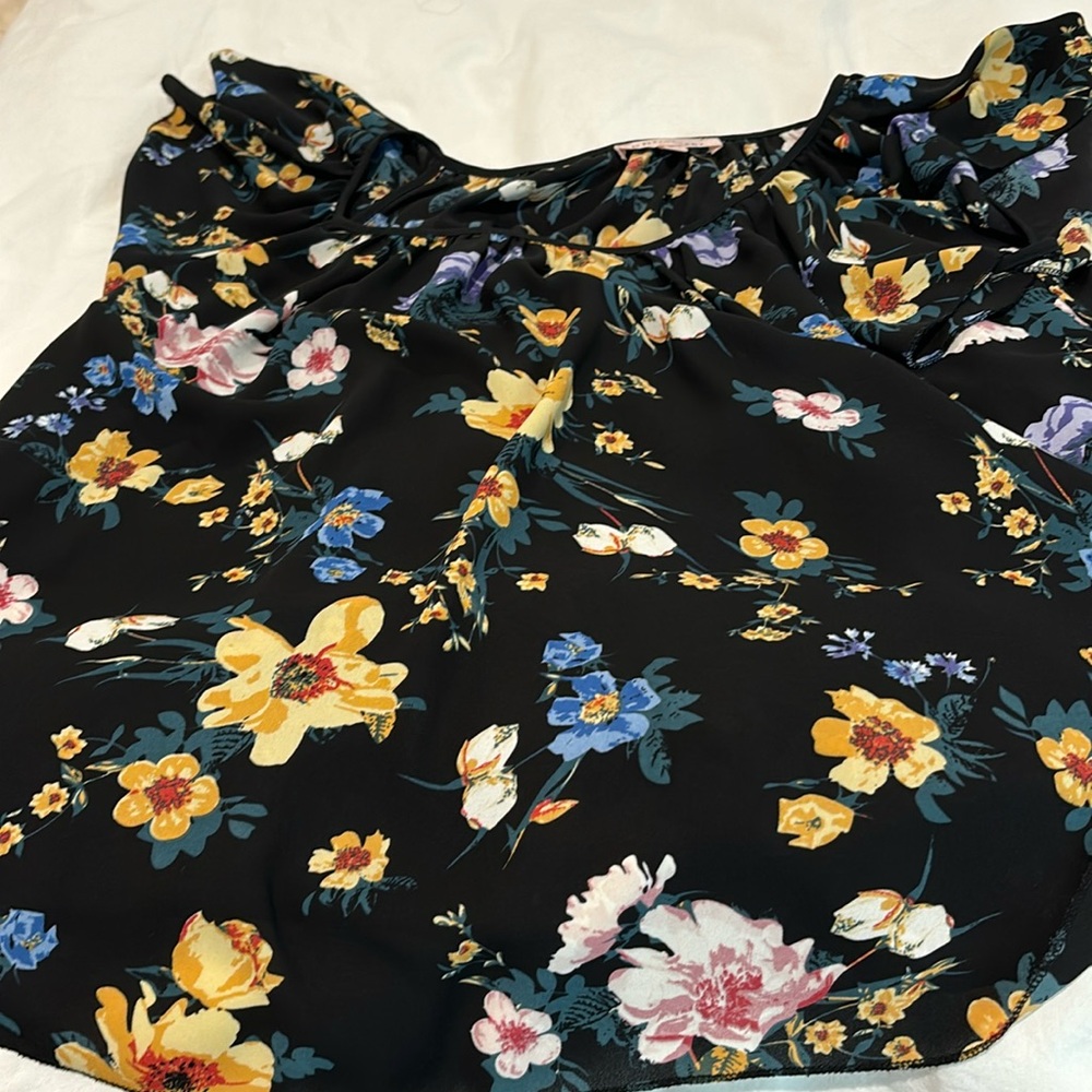 Floral blouse with a little bell sleeve.